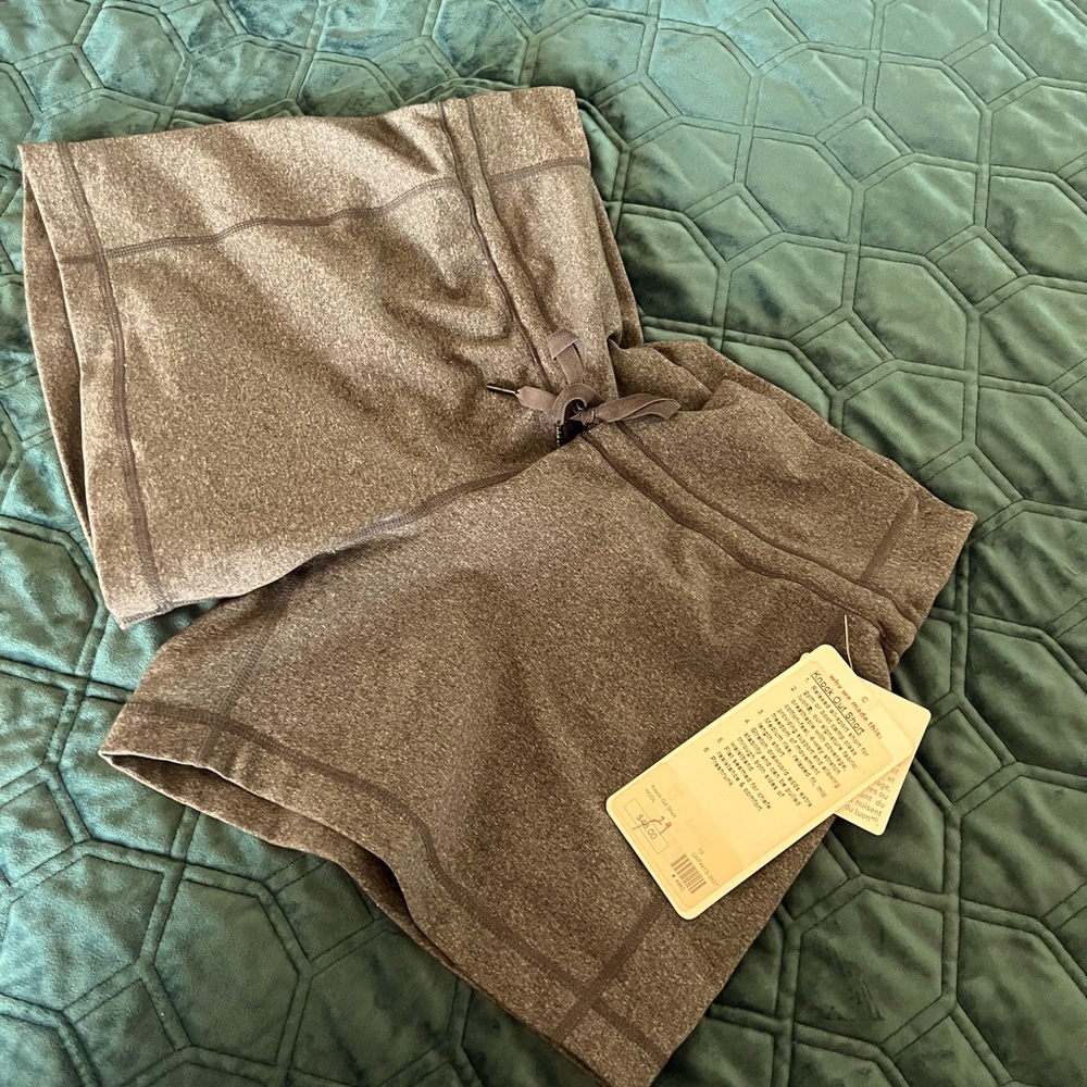 Stretchy, semi loose Lulu shirts. Medium grey, Never worn.